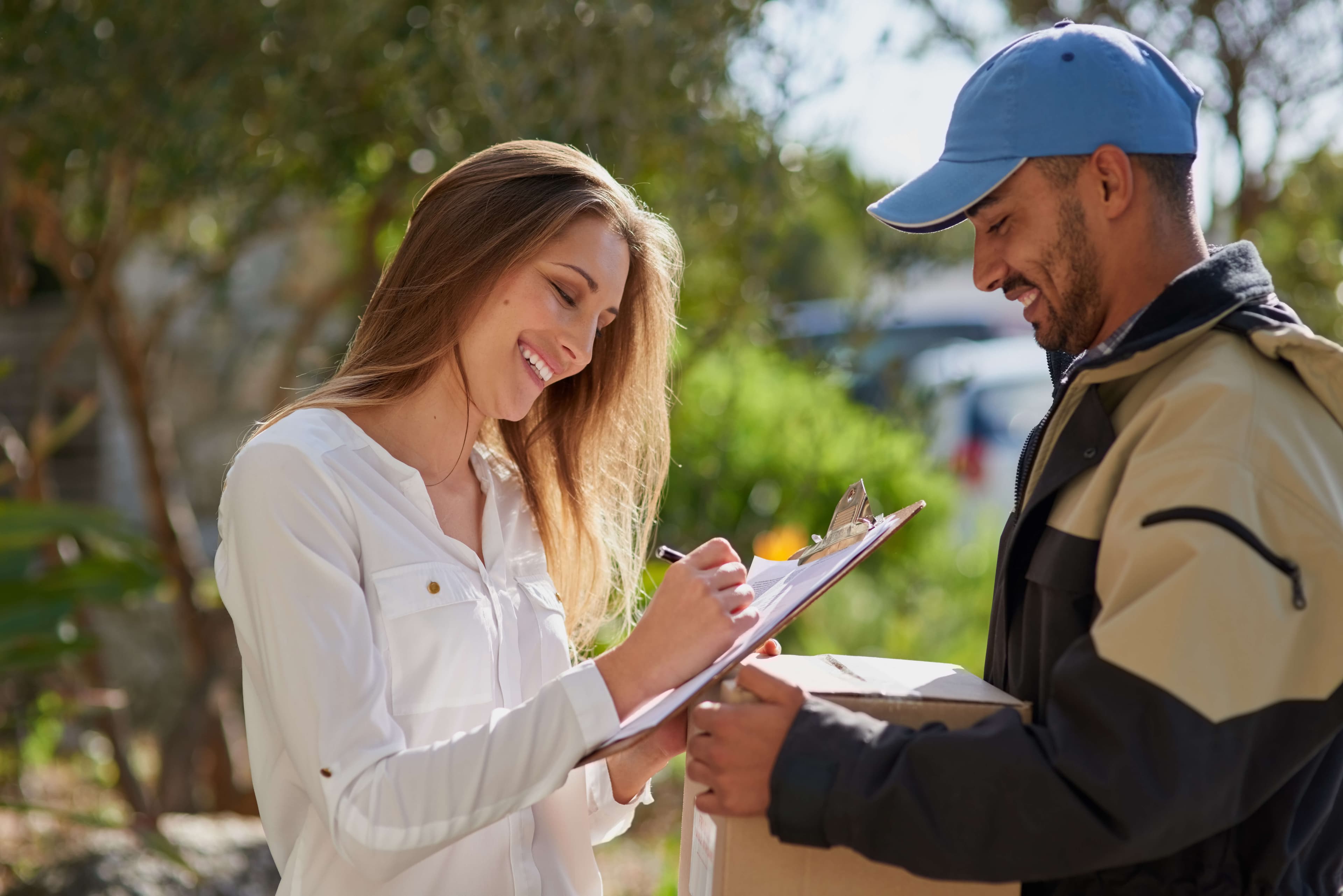 a satisfied customer signing paperwork