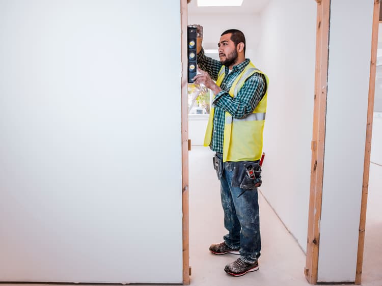 Carpenter working on a door frame